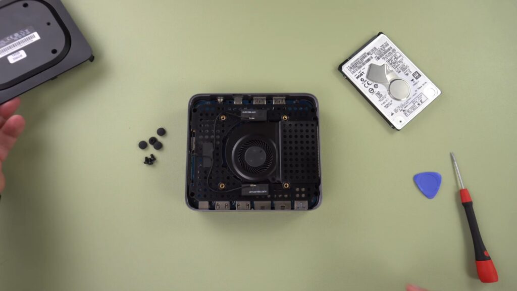 Lift the base of the mini PC