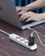 65W Power Supply for GPD WIN 3, AYA NEO and MacBook in black shown charing a MacBook laptop