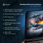 GPD WIN Mini 2024 handheld gaming PC display specs 7 FHD touchscreen with Corning Gorilla Glass 5 Features 120Hz VRR 314 PPI 500 nits brightness and 100 sRGB Image shows device screen with high action gaming scene emphasizing Stunning clarity and smoothness Specs list includes 10 point multi touch 1920x1080 resolution 168° opening angle and wide color gamut showcasing premium portable gaming experience