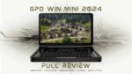 GPD WIN Mini 2024 Compact handheld gaming PC showcased in open clamshell position High resolution 7 inch display featuring a vibrant aerial view of a rural village with traditional houses and lush greenery Full QWERTY keyboard visible below the screen indicating dual functionality for gaming and productivity Device surrounded by stylized circuit board patterns emphasizing its technological prowess Text overlay reads GPD WIN MINI 2024 at the top and FULL REVIEW at the bottom with subtext listing UNBOXING   OVERVIEW   BENCHMARKS   GAMES   EMULATORS The image blends real hardware presentation with graphical elements suggesting a comprehensive review of the devices capabilities across various use cases Black chassis contrasts with the colorful screen content highlighting the devices sleek design and portability while promising powerful performance for gaming and beyond
