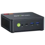 The image shows the GMKTEC NUBOX M5 Mini PC a sleek and compact computing device It has a modern design with a matte black finish The front panel features several connectivity ports including USB ports and an audio jack and the GMKTEC logo is prominently displayed on the top The overall design is minimalist emphasizing portability and functionality for diverse computing tasks