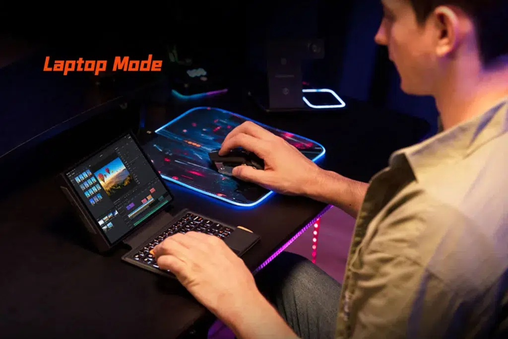 ONEXPLAYER X1 Mini 11 The ONEXPLAYER X1 Mini used as a compact laptop setup with a keyboard and mouse, running video editing software, highlighting its versatility for creative and productivity tasks.