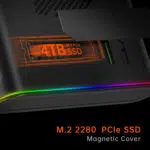 Close up of the ONEXGPU device showcasing its magnetic cover for an M2 2280 PCIe SSD featuring a highlighted 4TB SSD slot in orange with subtle RGB lighting along the device edges