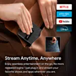 Outdoor camping scene with RockTek GB1 Android TV box showing its plug and play feature A father and child watch a projection screen displaying an astronaut riding a horse demonstrating the immersive visual experience the device offers on various displays like TV monitors projectors and portable monitors