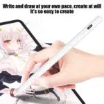 Hand holding a white capacitive stylus sketching an anime style character on a tablet screen accompanied by the text Write and draw at your own pace create at will Its so easy to create
