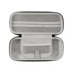 Interior view of the AYN Odin 2 and Portal carrying case showcasing a soft protective lining with mesh pockets and a zipper compartment for storing accessories