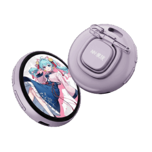 Two circular digital smart badges in a light lavender purple color. The front badge features a round LCD screen displaying an anime-style girl with blue hair in a pink and blue outfit. The rear badge shows the back casing with a safety pin attachment, a lanyard hole, and the text "NN-家族" on a central square button.