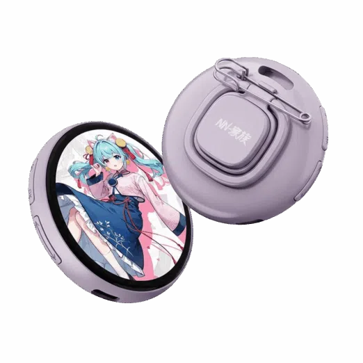 Two circular digital smart badges in a light lavender purple color. The front badge features a round LCD screen displaying an anime-style girl with blue hair in a pink and blue outfit. The rear badge shows the back casing with a safety pin attachment, a lanyard hole, and the text "NN-家族" on a central square button.